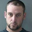 Mugshot of a man with short hair and a beard, looking directly at the camera. Mugshot of a man with short hair and a beard, looking directly at the camera.