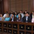 A diverse jury seated in a courtroom, observing a trial. A diverse jury seated in a courtroom, observing a trial.