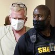 Alex Murdaugh being escorted by law enforcement following his arrest related to fraud charges and a failed suicide attempt. Alex Murdaugh being escorted by law enforcement following his arrest related to fraud charges and a failed suicide attempt.