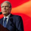 Wayne LaPierre, CEO of the NRA, speaking at a podium with a red background. Wayne LaPierre, CEO of the NRA, speaking at a podium with a red background.