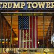 The entrance of Trump Tower in New York City, featuring the American flag and a clock. The entrance of Trump Tower in New York City, featuring the American flag and a clock.