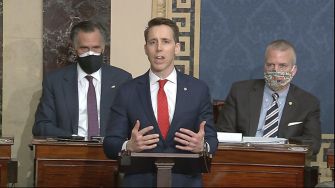Senator Josh Hawley speaking during the Senate session regarding objections to the election results, with other senators in the background.