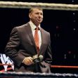 Vince McMahon speaking in a wrestling ring during a WWE event. Vince McMahon speaking in a wrestling ring during a WWE event.