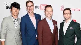 The Try Guys posing together at an event, featuring four members in formal attire.