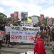 A crowd of protesters holding signs demanding justice for Alton Sterling and opposing police brutality during a Black Lives Matter demonstration. A crowd of protesters holding signs demanding justice for Alton Sterling and opposing police brutality during a Black Lives Matter demonstration.