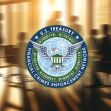 Logo of the U.S. Treasury's Financial Crimes Enforcement Network (FinCEN) with a blurred background of people in a meeting. Logo of the U.S. Treasury's Financial Crimes Enforcement Network (FinCEN) with a blurred background of people in a meeting.
