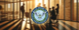 Logo of the U.S. Treasury's Financial Crimes Enforcement Network (FinCEN) with a blurred background of people in a meeting.