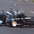 A motorcycle lying on its side on the road after a crash. A motorcycle lying on its side on the road after a crash.