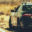 Police car on a highway with "HIGHWAY" written on the side. Police car on a highway with "HIGHWAY" written on the side.