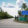 Sign for "Alligator Alcatraz," an immigration detention center in Florida, with a road leading to the facility surrounded by trees. Sign for "Alligator Alcatraz," an immigration detention center in Florida, with a road leading to the facility surrounded by trees.