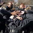 A group of police officers embracing one another in solidarity after the Nashville bombing incident. A group of police officers embracing one another in solidarity after the Nashville bombing incident.