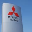 Mitsubishi Motors company sign against a clear blue sky. Mitsubishi Motors company sign against a clear blue sky.