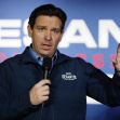 Governor Ron DeSantis speaking at an event, with a microphone in hand and gesturing. Governor Ron DeSantis speaking at an event, with a microphone in hand and gesturing.