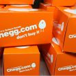 Chegg.com branded boxes stacked together with a cautionary message. Chegg.com branded boxes stacked together with a cautionary message.