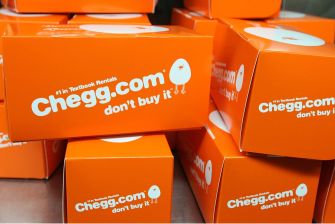 Chegg.com branded boxes stacked together with a cautionary message.