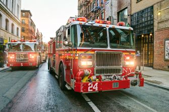 Fire trucks responding to a construction fire in the Bronx.