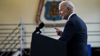 President Biden speaking at a podium, outlining his infrastructure plan.
