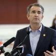 Virginia Gov. Ralph Northam talks at a COVID-19 vaccination event at Richmond Raceway in Richmond, Va., on Thursday, Jan. 21, 2021. (Dean Hoffmeyer/Richmond Times-Dispatch via AP)