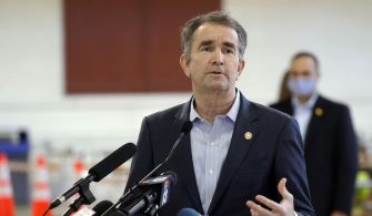 Governor Ralph Northam speaking at a press conference, advocating for the abolition of the death penalty in Virginia.