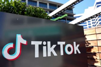 Signage featuring the TikTok logo outside one of its offices, symbolizing the platform's presence in the U.S. amid discussions of a potential ban.