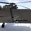 Damage to the tail end of a Black Hawk helicopter after a snowmobile collision. Damage to the tail end of a Black Hawk helicopter after a snowmobile collision.