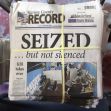 Front page of the Marion County Record newspaper with the headline "SEIZED ... but not silenced" and a photo of a police raid in the newsroom. Front page of the Marion County Record newspaper with the headline "SEIZED ... but not silenced" and a photo of a police raid in the newsroom.