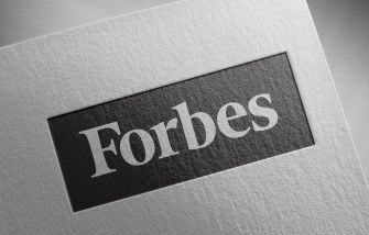 Forbes logo on a textured background.