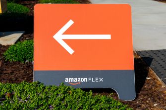 Signage indicating the direction for Amazon Flex drivers, featuring the Amazon Flex logo.