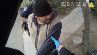 Body camera footage showing police officers interacting with a man in a park prior to a fatal encounter.