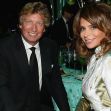 Image of Paula Abdul and Nigel Lythgoe at an event, both dressed formally. Image of Paula Abdul and Nigel Lythgoe at an event, both dressed formally.