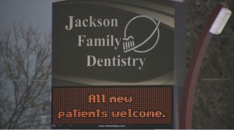 Sign for Jackson Family Dentistry welcoming new patients.