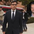 A physician walking outside a courthouse, accompanied by media personnel, with an inset image of an actor. A physician walking outside a courthouse, accompanied by media personnel, with an inset image of an actor.