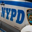 NYPD vehicle showing the department's logo and markings. NYPD vehicle showing the department's logo and markings.