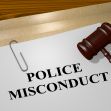 Image depicting a document labeled "POLICE MISCONDUCT" alongside a gavel, symbolizing legal matters related to police conduct. Image depicting a document labeled "POLICE MISCONDUCT" alongside a gavel, symbolizing legal matters related to police conduct.