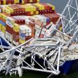Cargo ship involved in the Francis Scott Key Bridge collapse, showing damaged structure and fallen containers. Cargo ship involved in the Francis Scott Key Bridge collapse, showing damaged structure and fallen containers.