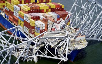 Cargo ship involved in the Francis Scott Key Bridge collapse, showing damaged structure and fallen containers.