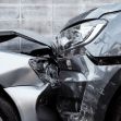 Close-up of two cars that have been involved in a front-end collision, highlighting the damage to the front of each vehicle. Close-up of two cars that have been involved in a front-end collision, highlighting the damage to the front of each vehicle.