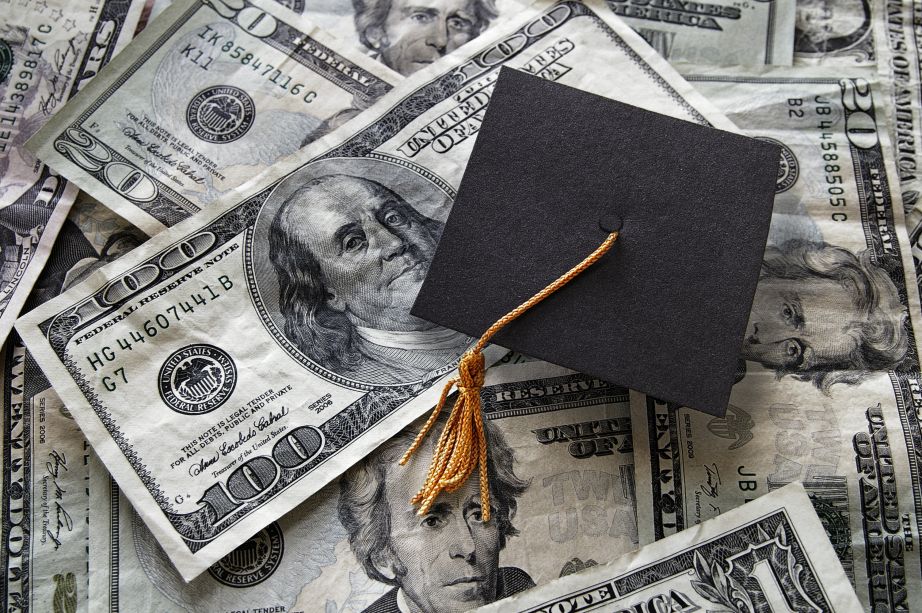 Student loan concept depicted with bills and graduation cap