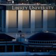 Liberty University campus building with the name prominently displayed. Liberty University campus building with the name prominently displayed.