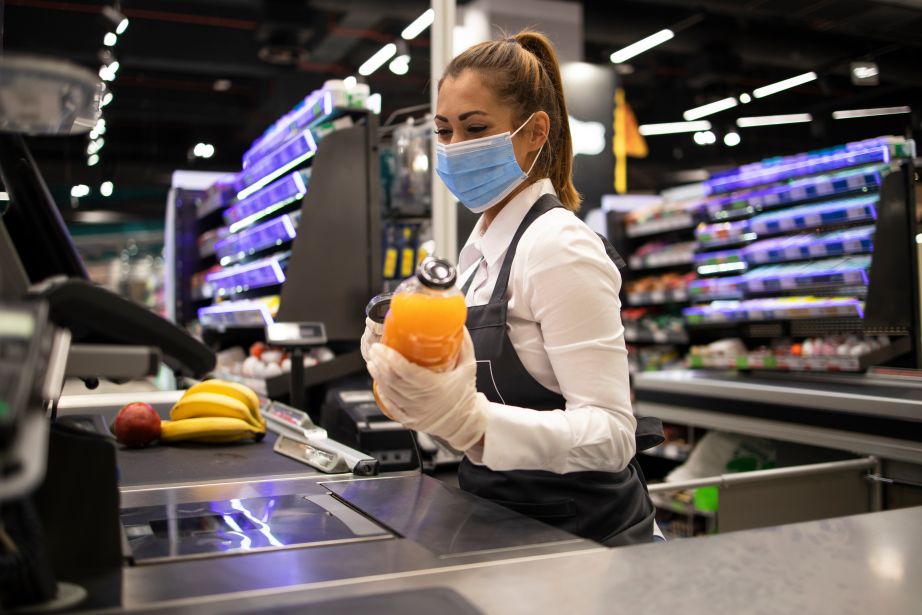 Grocery store worker with a mask