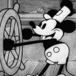 Black and white image of Mickey Mouse in "Steamboat Willie," steering a ship's wheel. Black and white image of Mickey Mouse in "Steamboat Willie," steering a ship's wheel.