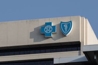 The logo of Blue Cross Blue Shield displayed on a building exterior.