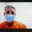 Police officer Christopher Schurr appearing in court via video link, wearing an orange jumpsuit and a mask. Police officer Christopher Schurr appearing in court via video link, wearing an orange jumpsuit and a mask.