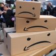 Stacked cardboard boxes with sad face designs, representing the Make Amazon Pay campaign. Stacked cardboard boxes with sad face designs, representing the Make Amazon Pay campaign.