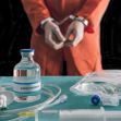 A handcuffed person in an orange jumpsuit is shown behind a bottle labeled "Sodium Thiopental" and medical equipment associated with lethal injection executions. A handcuffed person in an orange jumpsuit is shown behind a bottle labeled "Sodium Thiopental" and medical equipment associated with lethal injection executions.