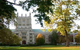 Vassar College campus with a prominent building and surrounding trees.