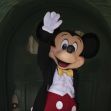 A character in a tuxedo waving, resembling a popular cartoon mouse. A character in a tuxedo waving, resembling a popular cartoon mouse.