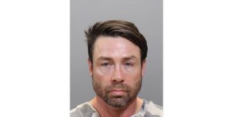 Mugshot of Geoffrey Paschel, a former reality TV star sentenced to 18 years for domestic assault charges.