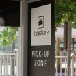 Sign indicating a rideshare pick-up zone. Sign indicating a rideshare pick-up zone.