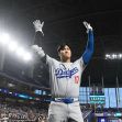 Shohei Ohtani of the Los Angeles Dodgers saluting the crowd during a game at LoanDepot Park in Miami. Shohei Ohtani of the Los Angeles Dodgers saluting the crowd during a game at LoanDepot Park in Miami.